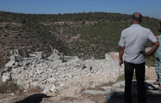September 10, 2026, Hebron, West Bank, Palestinian Territory: Heavy machinery accompanied by Israeli forces demolishes a Palestinian building, as Palestinians inspect the rubble afterward, in the town of Battir, west of Bethlehem, in the occupied West Ban