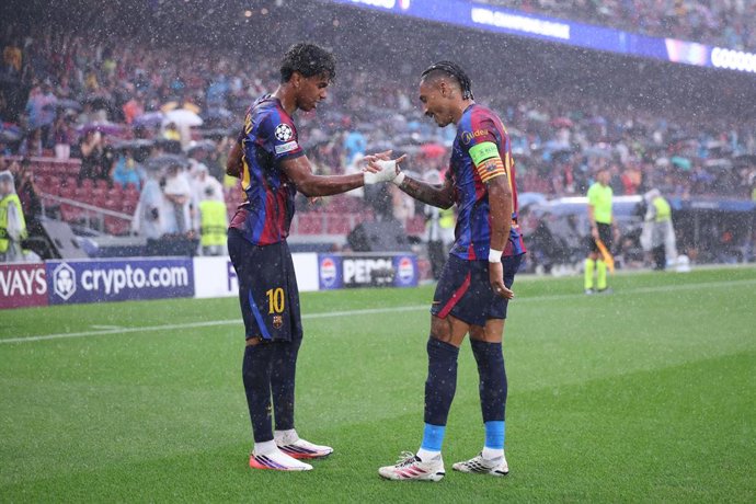 Raphinha Dias Belloli of FC Barcelona celebrates after scoring his team's first goal with teammate Lamine Yamal of FC Barcelona during the UEFA Champions League 2026/27 League Phase MD1, football match played between FC Barcelona and Feyenoord at Spotify 