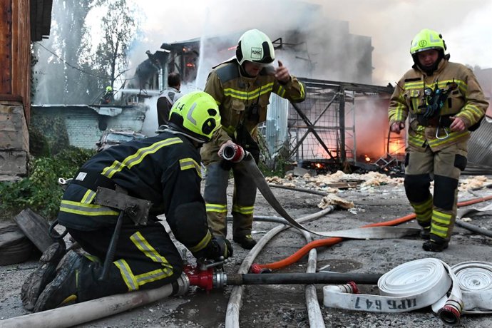September 11, 2026, Kyiv, Ukraine: Firefighters work near the scene of a fire after a jet-powered drone struck an office building in Kyiv's Podilskyi district. The Russian army struck offices in Kyiv's Podilskyi district, destroying the facility and civil