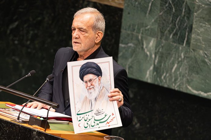 September 23, 2026, New York City, USA: Iranian President Masoud Pezeshkian holds up a portrait of Iran's Supreme Leader Ayatollah Ali Khamenei at the beginning of his address on the second day of the General Debate of the 81st session of the United Natio