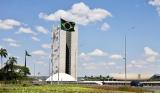 BRASILIA, Sept. 25, 2026  -- This photo taken on Sept. 24, 2026 shows the Brazilian national flag and the National Congress of Brazil in the background in Brasilia, Brazil. The city of Brasilia, with a population of approximately 3 million, is the capital