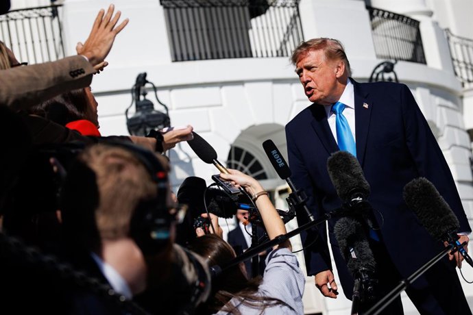 October 5, 2026, Washington, District Of Columbia, USA: United States President Donald J Trump speaks to reporters on the South Lawn of the White House in Washington, DC, USA, before departing aboard Marine One on October 5, 2026. Trump is traveling to Gr