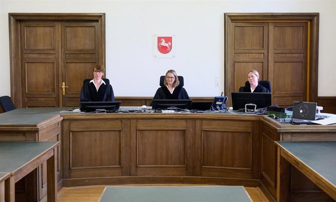 Presiding judge Anke Siegfried sits in a courtroom at the Braunschweig Regional Court alongside two other judges from the panel, a representative of the Federal Aviation Authorit, and attorney Rebecca Hans, representing the Federal Republic of Germany. 