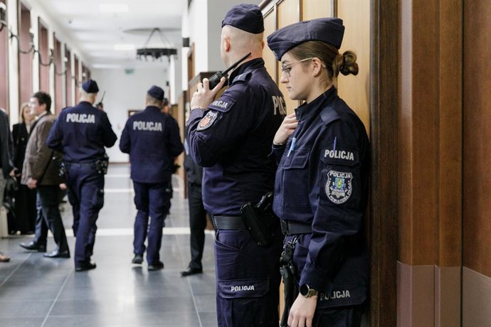Archivo - January 15, 2026, Warsaw, Poland: Police officers stands outside a courtroom at the District Court in Warsaw ahead of a hearing in the case of Russian archaeologist Aleksandr Butiagin, accused by Ukraine of unauthorised excavation and plundering