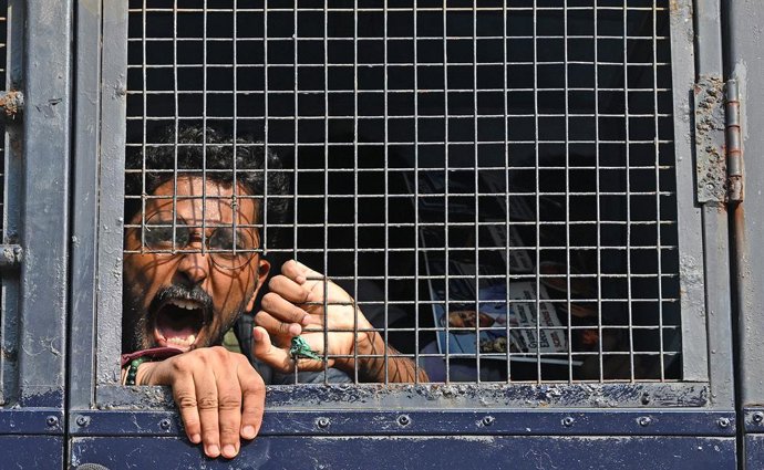 October 10, 2026, Mumbai, Maharashtra, India: A protestor shout slogan from a police van after being detained during a protest near August Kranti Maidan (an area in South Mumbai) in Mumbai. Protestors gathered to protest in solidarity with demonstration i