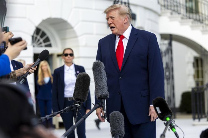 October 12, 2026, Washington, District Of Columbia, USA: US President Donald J. Trump responds to a question from the news media as he walks to board Marine One on the South Lawn of the White House in Washington, DC USA, 12 October 2026. Trump is travelin