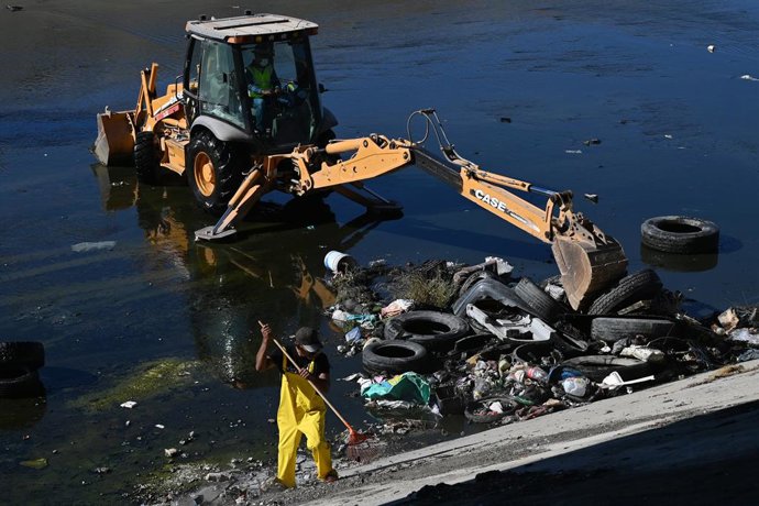October 2, 2026, Tijuana, Baja California, Mexico: Wildcoast and Baja California environmental groups with university organizations and state authorities organized to  help remove trash and old tires from the Tijuana River channel in Tijuana, Mexico on Fr