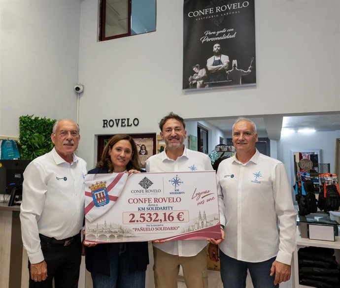 Entrega de la donación de Confe Rovelo a Km Solidarity