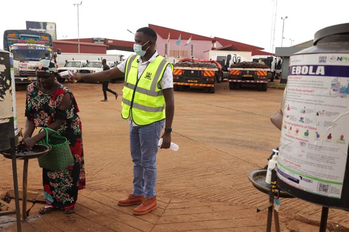 NAIROBI, Oct. 17, 2026  -- A Health official monitors the body temperatures of a lady entering Kenya at the One-Stop Border Post in Busia, Kenya, Oct. 16, 2026. Kenya's Ministry of Health on Saturday confirmed four new cases of Ebola Bundibugyo virus dise