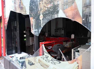 PARIS, Oct. 18, 2026  -- A shop damaged during a protest is seen in Paris, France, Oct. 18, 2026. French President Emmanuel Macron on Sunday vowed legal action against those responsible for violence during protests across the country on Saturday.