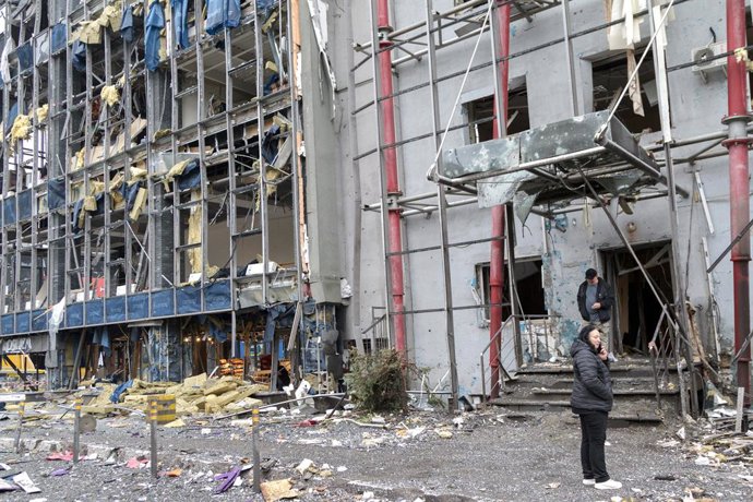 October 19, 2026, Kyiv, Ukraine: People stand outside a building in the Solomianskyi district damaged by a Russian attack, Kyiv, Ukraine, October 19, 2026. During the night and morning, Russia launched a massive strike on the capital using ballistic missi