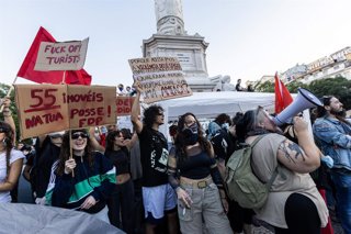 October 17, 2026, Lisbon, Portugal: Protesters hold up signs and shout slogans during a protest against the lack of housing. Protesters set up an overnight tent camp in central Rossio Square following a nationwide demonstration through Lisbon. Organized a