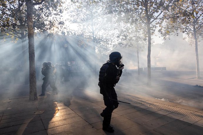 Paris, France: IPA89895761 - Paris, protest on October 18 near Place de la République; protesters clashing with police; police used tear gas at Place de la République; police officer (CRS)