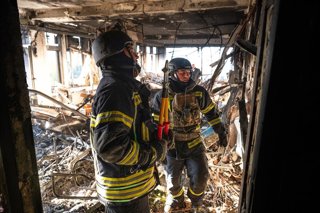 October 20, 2026, Kyiv, Ukraine: State Emergency Service workers address extensive damage to a multi-storey building in the Holosiivskyi district caused by a Russian drone attack, Kyiv, Ukraine, October 20, 2026.
