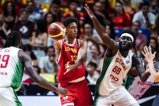 Archivo - Baba Miller of Spain B and Neemias Queta of Portugal in action during City of Malaga Tournament, basketball match played between Spain B and Portugal at Jose Maria Martin Carpena Pavilion on August 7, 2025, in Malaga, Spain.