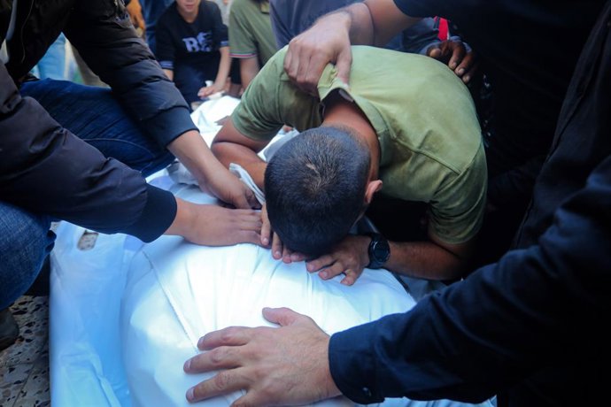 October 20, 2026, Gaza, Gaza Strip, Palestinian Territory: Mourners bid farewell to the bodies of three Palestinians, including a man and his wife, at al-Shifa Hospital in Gaza City, on October 20, 2026. The three were killed in two Israeli airstrikes tar