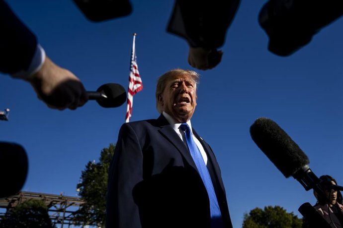 October 22, 2026, Washington, District Of Columbia, USA: United States President DONALD J TRUMP speaks to the press before departing from the South Lawn of the White House on Thursday. Trump is traveling to Sioux City, Iowa to attend a campaign rally with