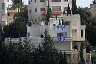 October 24, 2026, Hebron, West Bank, Palestinian Territory: Israeli soldiers raise Israeli flags over a Palestinian home after raiding and converting it into a military post in the West Bank city of Hebron, on October 24, 2026. The incident comes amid an 
