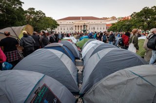 October 24, 2026, Lisbon, Portugal: Rows of tents set up in Rossio Square, with the D. Maria II National Theatre in the background, during the demonstration. People march through central Lisbon during a demonstration demanding affordable housing and prote