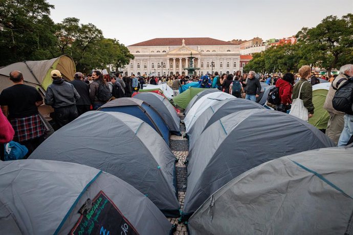 October 24, 2026, Lisbon, Portugal: Rows of tents set up in Rossio Square, with the D. Maria II National Theatre in the background, during the demonstration. People march through central Lisbon during a demonstration demanding affordable housing and prote