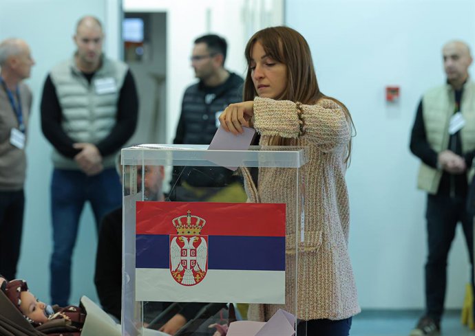 BELGRADE, Oct. 25, 2026  -- A woman casts her ballot for the early parliamentary election at a polling station in Belgrade, Serbia, on Oct. 25, 2026. Polling stations opened across Serbia at 7 a.m. local time (0600 GMT) on Sunday in snap parliamentary ele