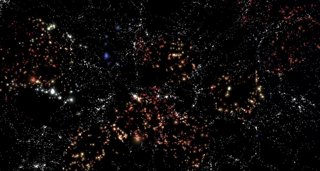 Archivo - Representación de la estructura a gran escala del Universo. Las galaxias coloreadas representan las galaxias en vacíos usadas en CAVITY. El color y tamaño de las galaxias no está representado a escala. Créditos: Andoni Jiménez.