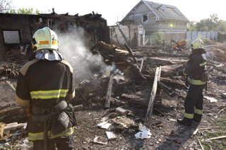 October 24, 2026, Dnipro, Ukraine: Rescuers extinguish a fire caused by a Russian attack drone that struck a residential building in Dnipro, Ukraine, October 24, 2026. Russian forces targeted a residential area of the city with a drone. One person was kil