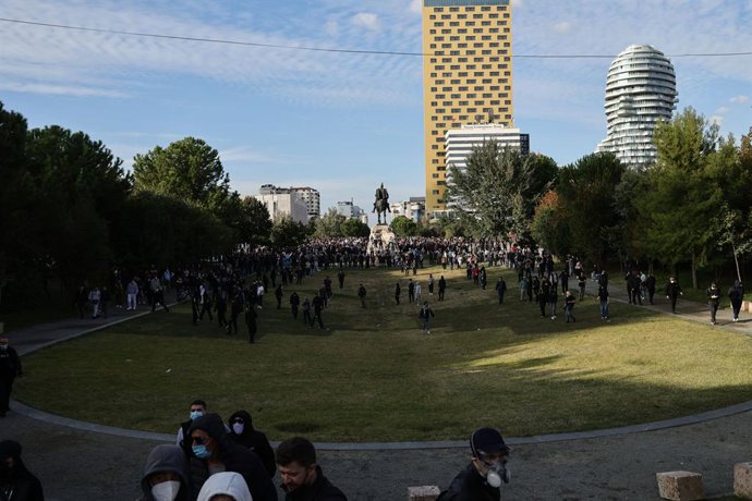 October 24, 2026, Tirana, Albania: TIRANA, ALBANIA, OCTOBER 24, 2026: Demonstrators clash with riot police during an anti-government protest in central Tirana. Protesters throw stones, pyrotechnics and petrol bombs, while police use tear gas, water cannon