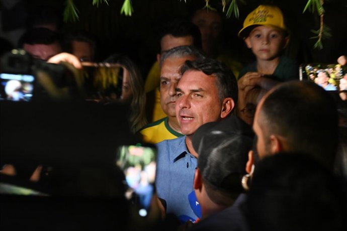 BRASILIA, Oct. 5, 2026  -- Flavio Bolsonaro (C), presidential candidate of Brazil's Liberal Party, speaks after the announcement of the first-round results of the presidential election in Brasilia, Brazil, Oct. 4, 2026.   Brazil will hold a presidential r