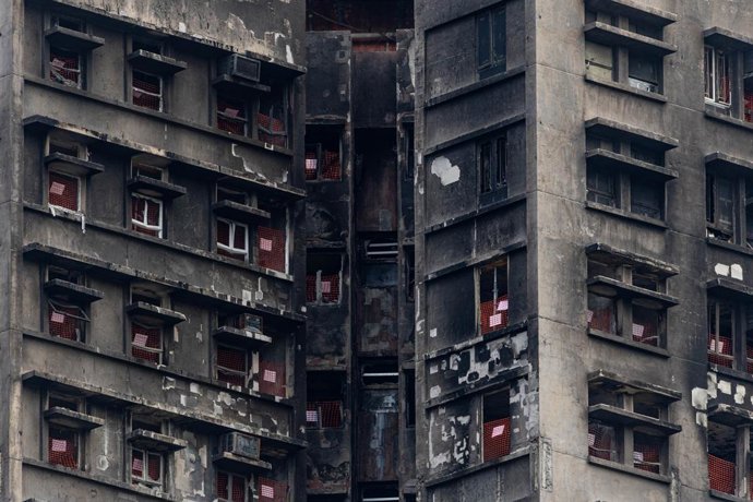 Archivo - May 13, 2026, Hong Kong, Hong Kong, China: A close-up of damaged residential flats at Wang Fuk Court in Tai Po, more than five months after the fire-related tragedy. Since April, retrieval phases have begun for residents of the affected blocks a